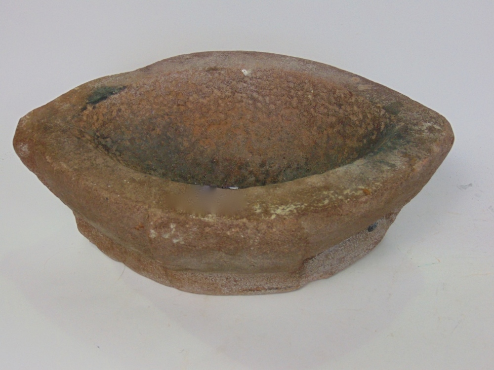 Antique stone mortar of oval form