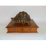 Eastern blonde wood games box mounted with a tortoise, the shell with hinge enclosing a marquetry