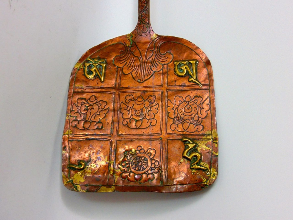 An interesting Tibetan copper shovel with brass relief decoration; together with an antique - Image 3 of 4