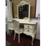 A contemporary Willis & Gambier cream painted kneehole dressing table with moulded outline over an