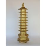 Gilt cast metal study of a tall pagoda, 50cm high