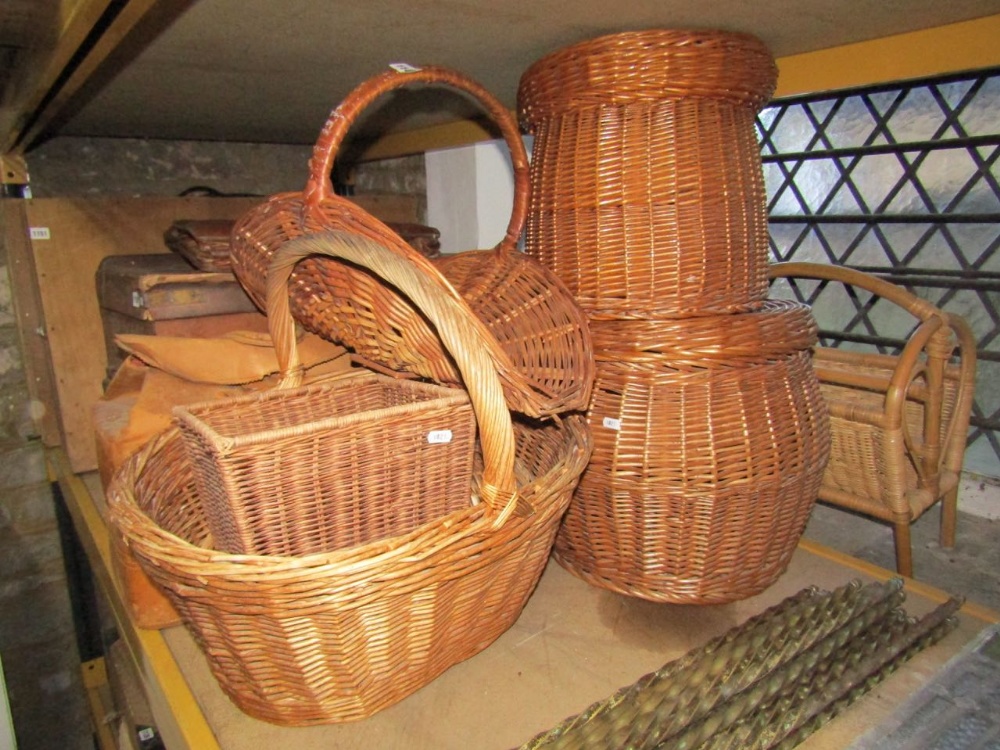 A small collection of contemporary wicker baskets and two divisional Canterbury