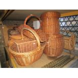 A small collection of contemporary wicker baskets and two divisional Canterbury