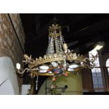 Continental gilt metal and prismatic drop ceiling light. with eight scrolled branches and eight