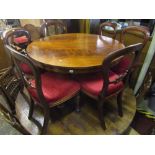 A Victorian mahogany tilt top breakfast table of circular form with well matched flame veneers