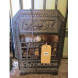 A small vintage cast iron heater with decorative foliate, geometric and bead work detail, stamped