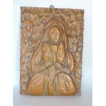 19th century embossed copper panel of a female character praying, with abstract surround, 39 x 28