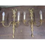 A set of six good quality cast brass two branch wall lights in the Georgian manner with ribboned and