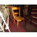 Three Swedish stained beechwood stick back kitchen chairs with circular seats raised on turned