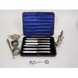 Mixed collection of silver to include three piece cruet set, two napkin rings, souvenir spoon,