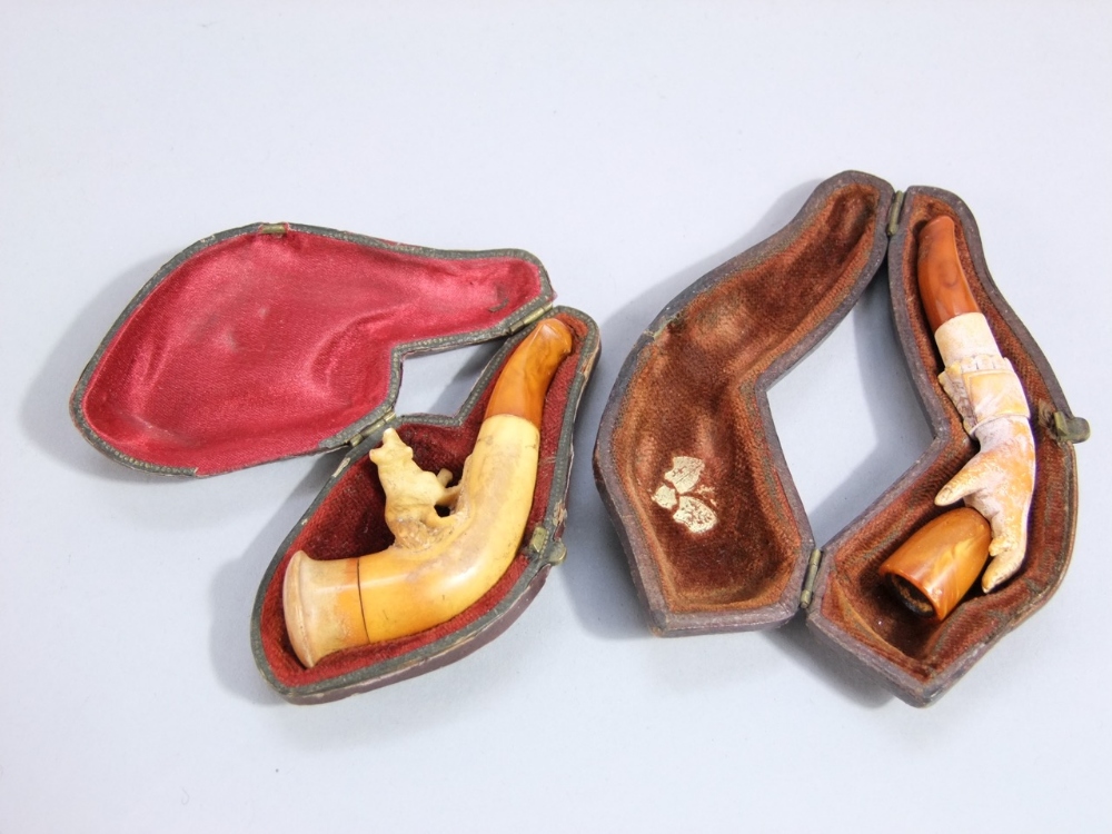 Two 19th century Meerschaum cheroot holders, both cased, a hand clasping a beaker and a startled - Image 3 of 3