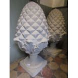 A pair of good quality buff coloured cast composition stone pineapple finials, the squat pedestals