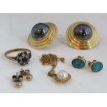 Three pairs of gold earrings to include a circular pair marked 14k and a 9ct pair set with opals,