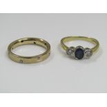 An 18ct ring set with a sapphire flanked by two diamonds, together with a further 9ct ring set