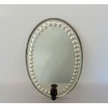 A Venetian mirrored oval wall sconce