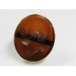 A gentleman's 9ct ring set with a large oval intaglio depicting a male profile, size W, 21g