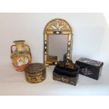 A Victorian papier mache and mother of pearl inlaid tea caddy, the hinged lid enclosing a fitted