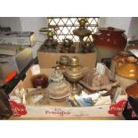 A collection of vintage brass and copper oil lamps of varying design, storm lantern, etc