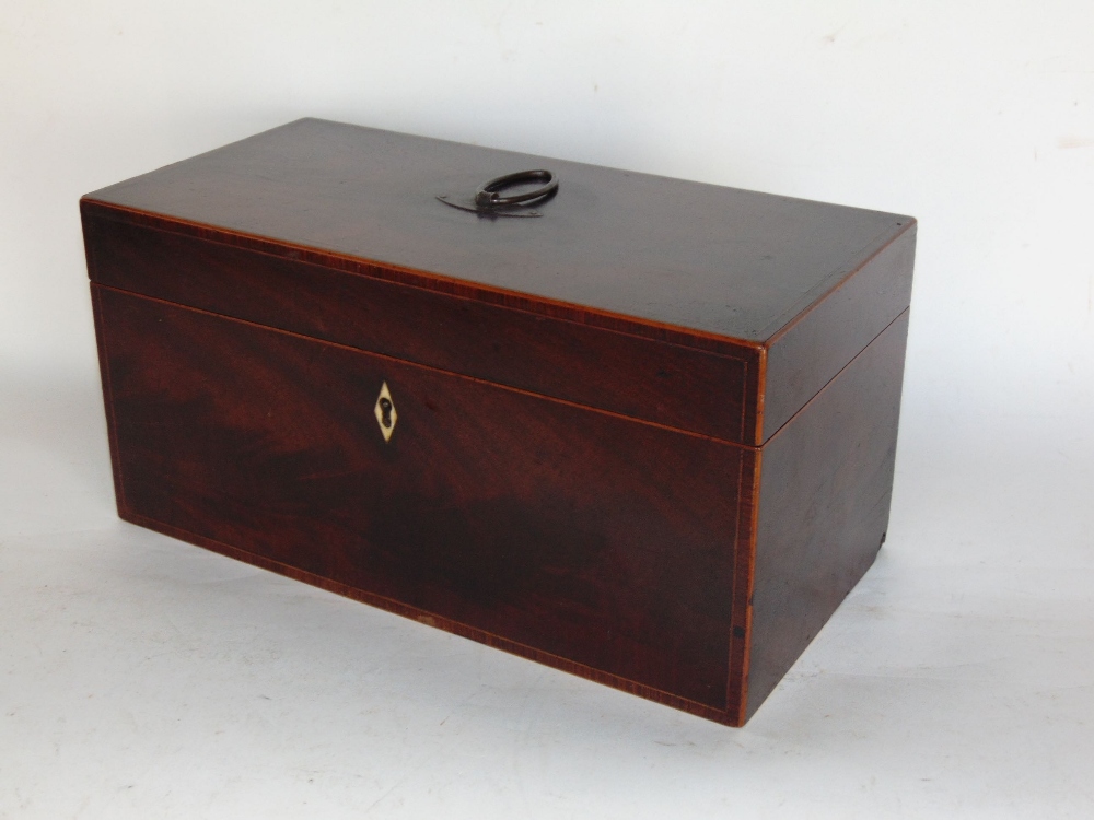 A 19th century flame mahogany tea caddy, the hinged lid enclosing a fitted interior to include two - Image 2 of 2