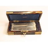 A fine cased set of seven cut throat razors with armorial crests, the blades by T Pigall, 22