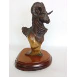 Cast bronze study of a rams bust, indistinctly signed D Miordi, upon a wooden plinth base