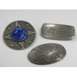 Three pewter brooches; a Jorgen Jensen brooch stamped Denmark together with a similar example (