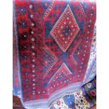 Meshwari runner decorated with red diamonds upon a navy blue ground, 245 x 60cm