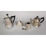 Pretty matched four piece early 20th century silver tea service, embossed with floral swags, 25oz