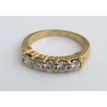 An 18ct five stone diamond ring, size L, 4.5g