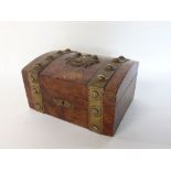 Attractive yew wood and brass bound casket, the lid fitted with a crest of two cherubs and further