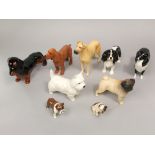 A collection of eight various Beswick dogs including a matt glazed model of a pug, Cutmil Qupie, a