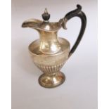 Edwardian silver Georgian style baluster water jug, with gadrooned bowl and sea scroll handle, maker