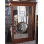 Oak framed wall mirror of rectangular form with reeded detail and moulded pediment, 136 cm high x 90