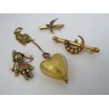 Three 9ct items comprising; a crescent bar brooch, an articulated pendant in the form of a girl, a