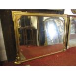 A gilt framed overmantle mirror of rectangular form, moulded and stepped outline and applied