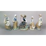 A collection of four Nao figure groups of a woman and child, a woman with goose, etc, together