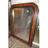 A vintage French wall mirror, the arched moulded frame with ebonised and painted simulated