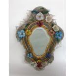 An impressive Venetian glass serpentine wall mirror with shaped original glass plate applied with