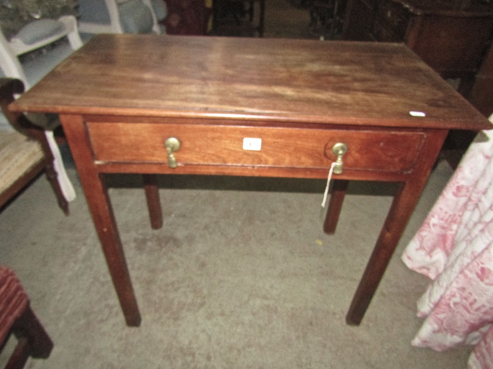 A Georgian mahogany side table of rectangular form with frieze drawer raised on four square cut