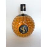 A bottle of Old St Andrews Scotch Whiskey with a novelty golf ball bottle, 18 cm high