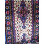 Persian style wool runner with triple medallion centre, upon a white field within geometric