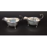 Pair of Edwardian silver cream jugs, with serpentine borders and sea scroll handles, maker marks