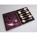 Case set of six fancy silver teaspoons together with a further silver book mark in the form of a