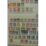 Three stockbooks containing a collection of world stamps including Middle East, Belgium, Israel,