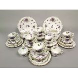 A collection of Hammersley China Violet pattern wares including a pair of cake plates, milk jug,