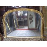 A Victorian overmantle mirror with arched moulded gilt frame, 124 cm x 82 cm approx