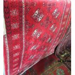 Persian thick weave wool runner with various geometric medallions upon a red ground, 170 x 95 cm