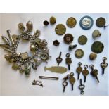 A silver chain bracelet hung with numerous charms, 4oz together with a selection of Victorian and