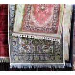 Five various floor rugs to include a tree of life type rug a Persian silk Bokhara style rug and