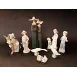 A Lladro matt glazed group of a pair of nuns, 34 cm tall, together with further Lladro figures and